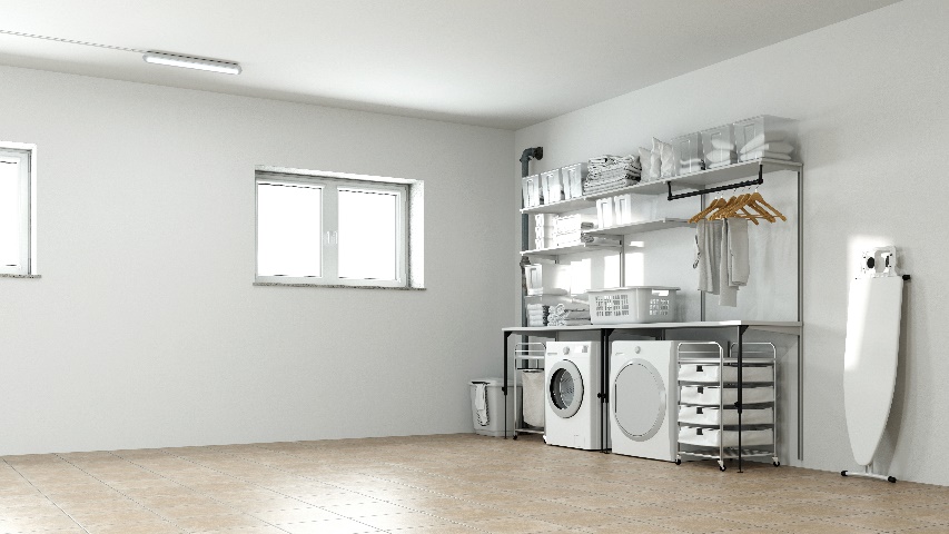 A picture of a basement with a washer and dryer, and basement windows letting in the sunlight.